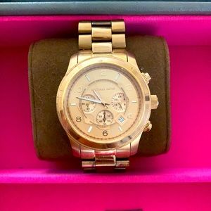 Michael Kora rose gold watch.